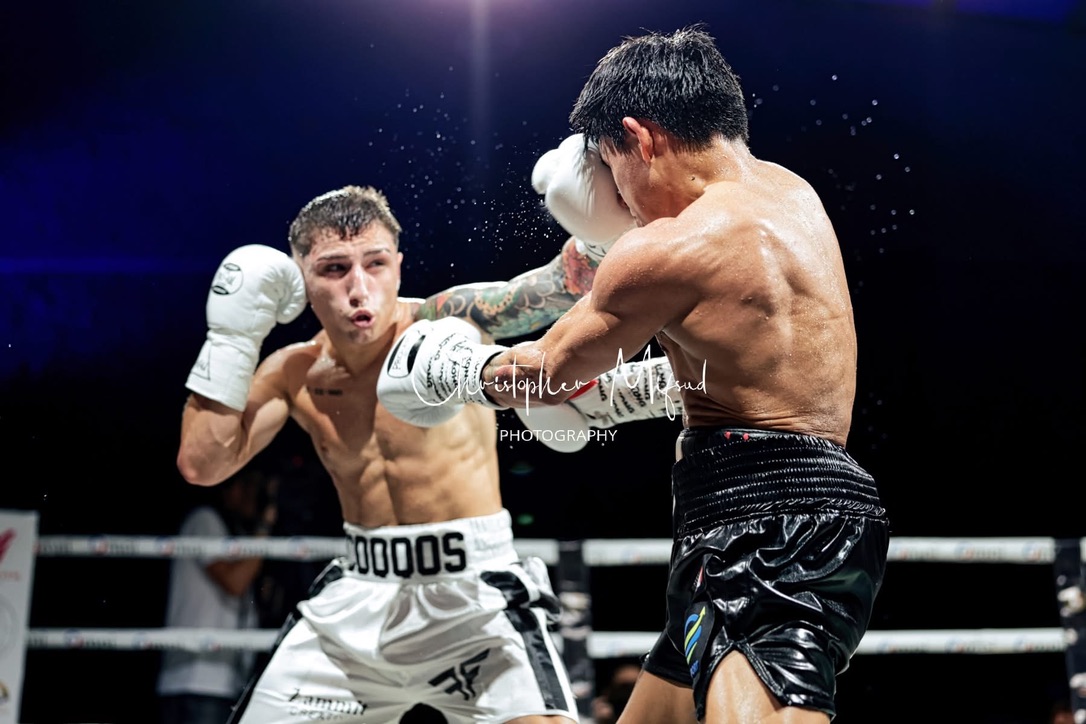 Fight Factory boxer landing a punch during a bout in Malta